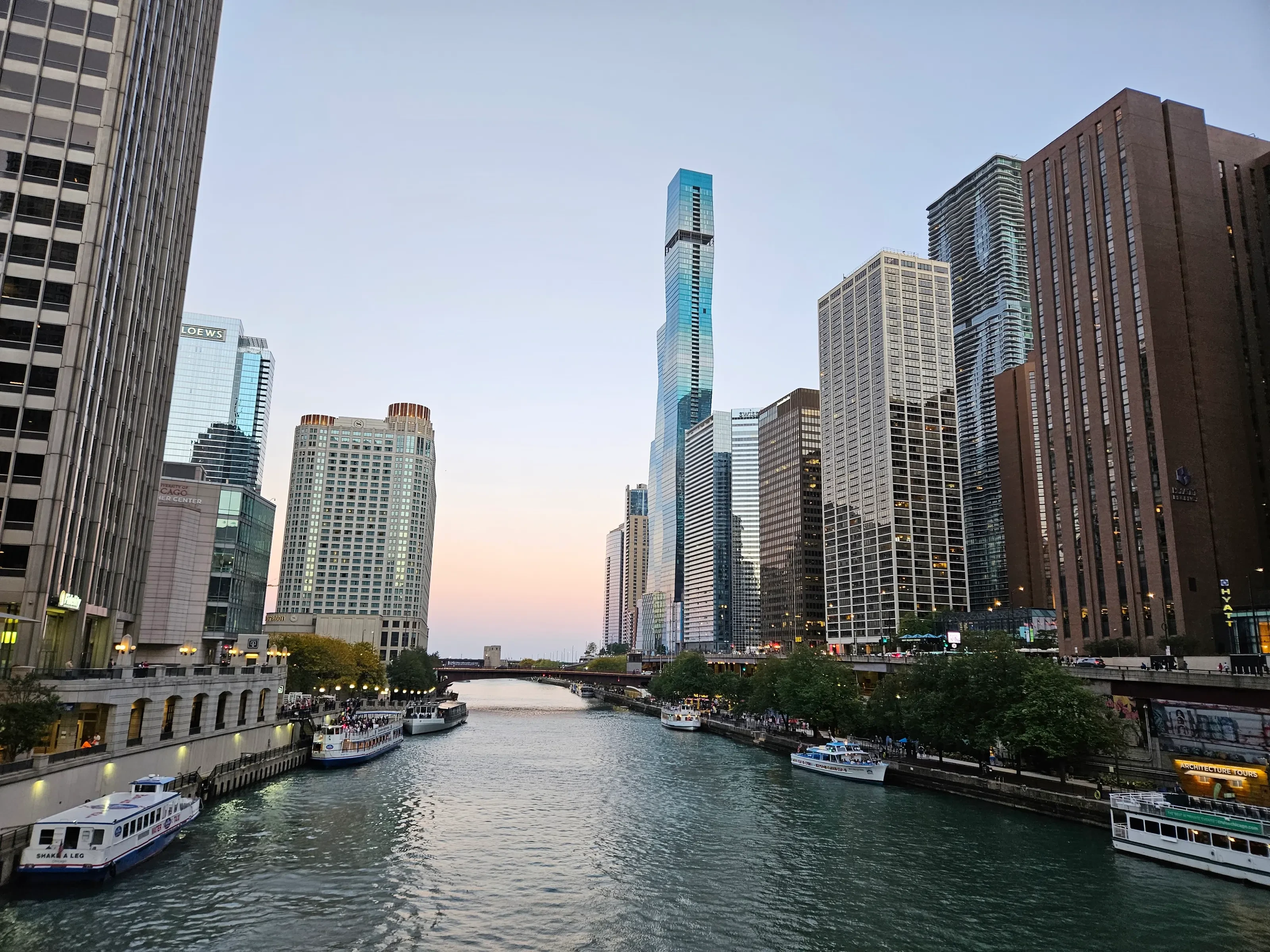 Chicago River boats and riverfront architecture at golden hour