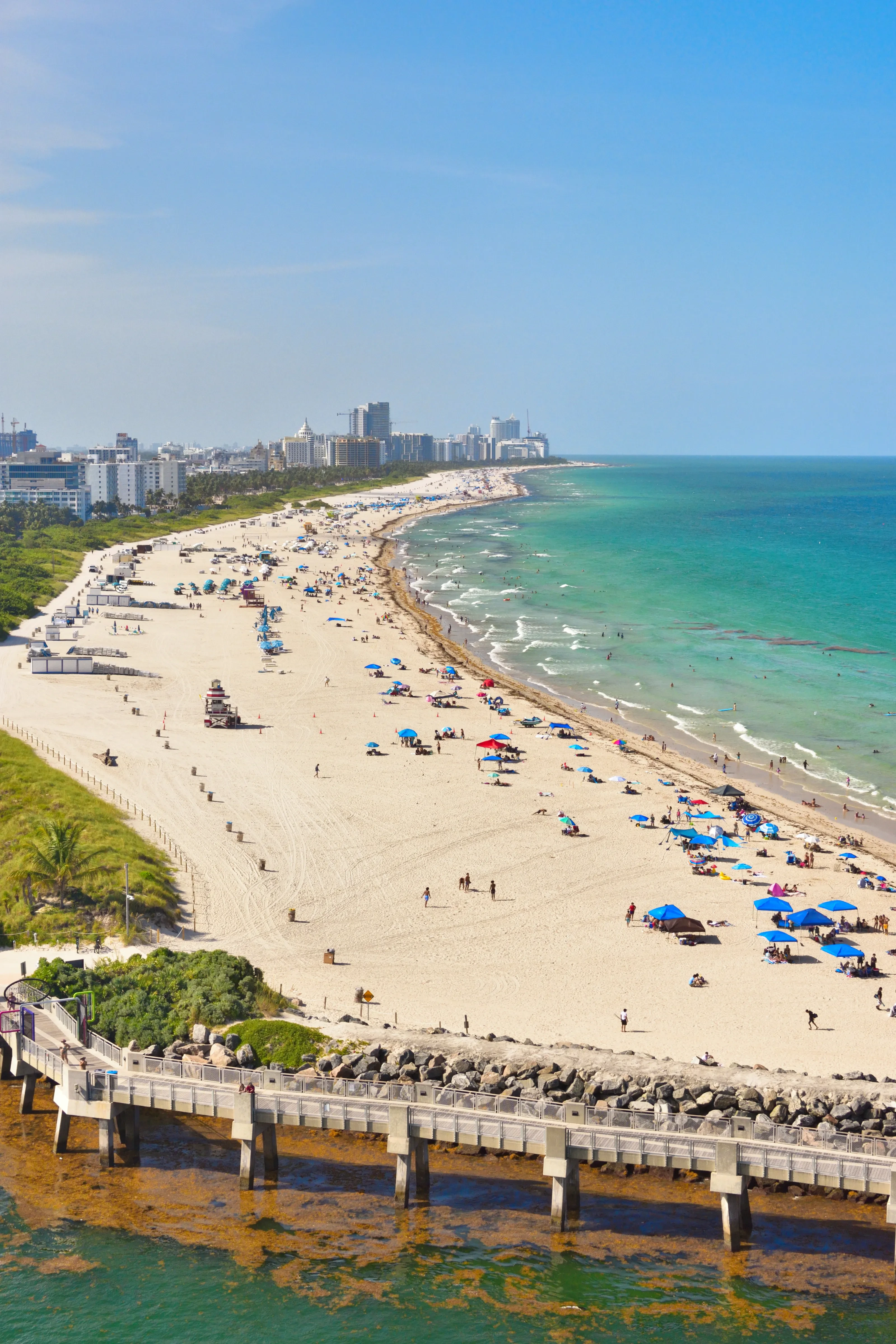 South Beach's sweeping shoreline, colorful umbrellas, and South Pointe Pier in Miami Beach
