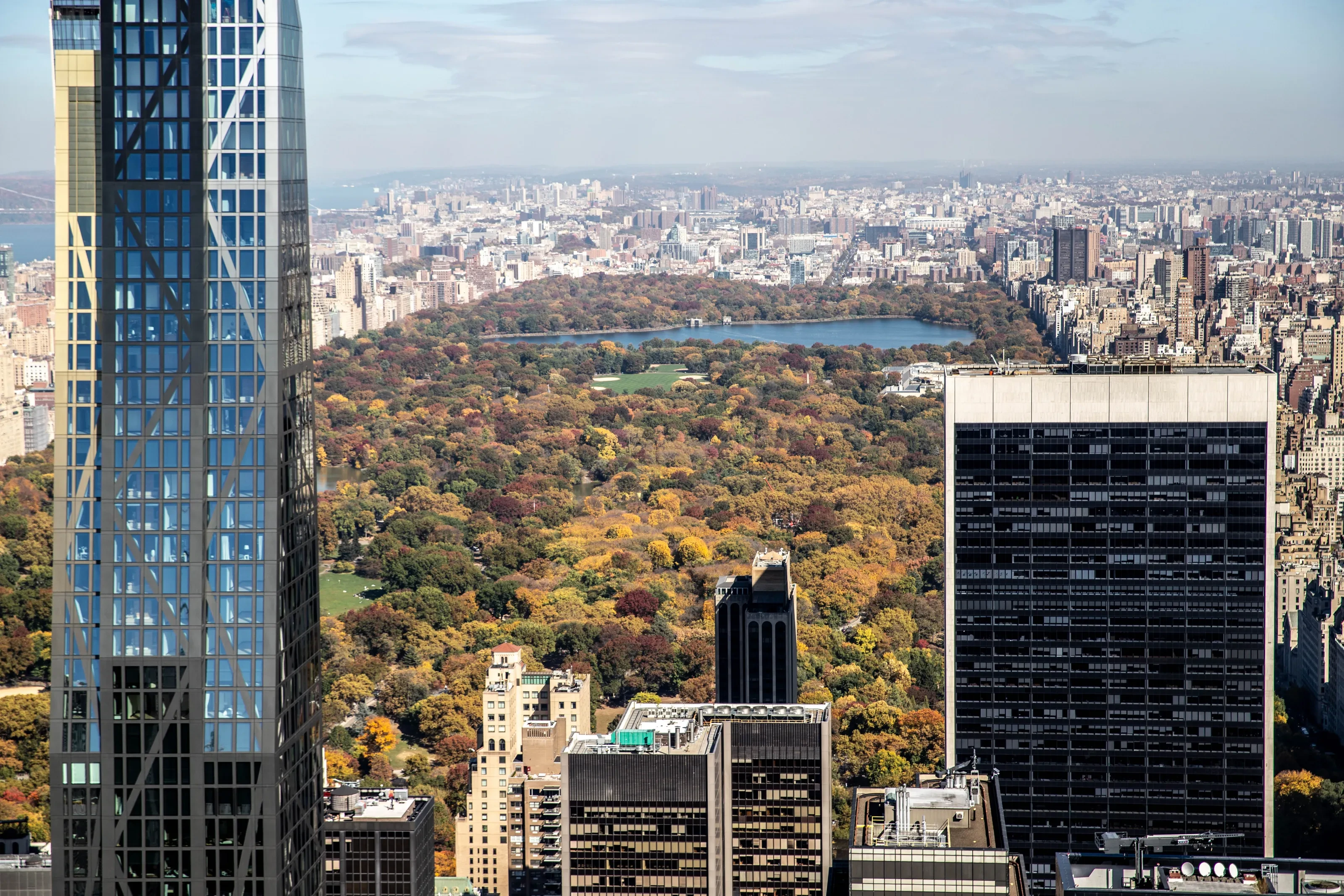 Autumn foliage in Central Park framed by Manhattan's glass towers