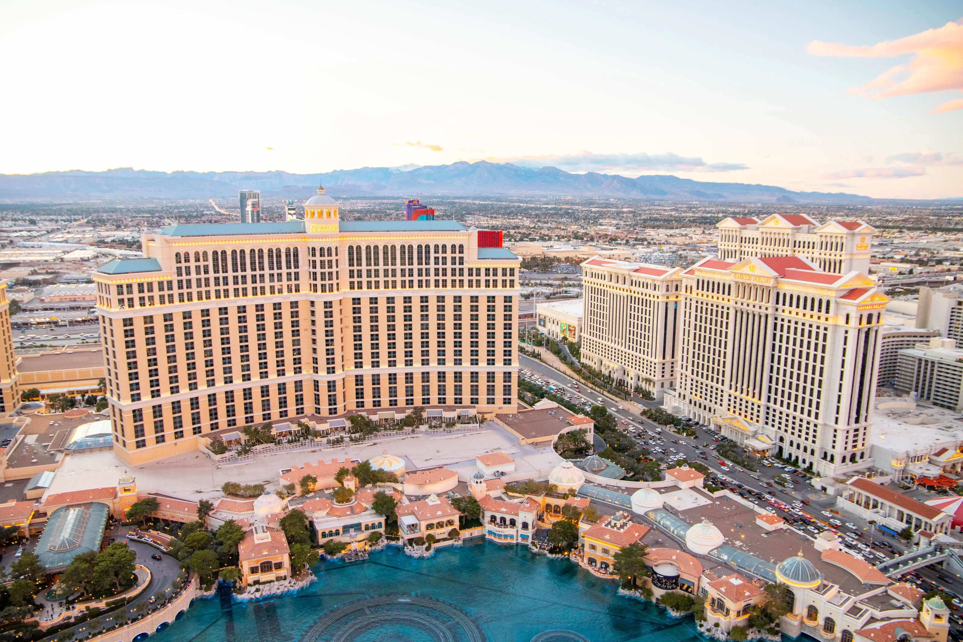 An elevated view of the Bellagio, Caesars Palace, and the Las Vegas Strip at dusk